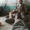 Another exhausted Marine. They can fall asleep within a minute of a battle ending, anywhere